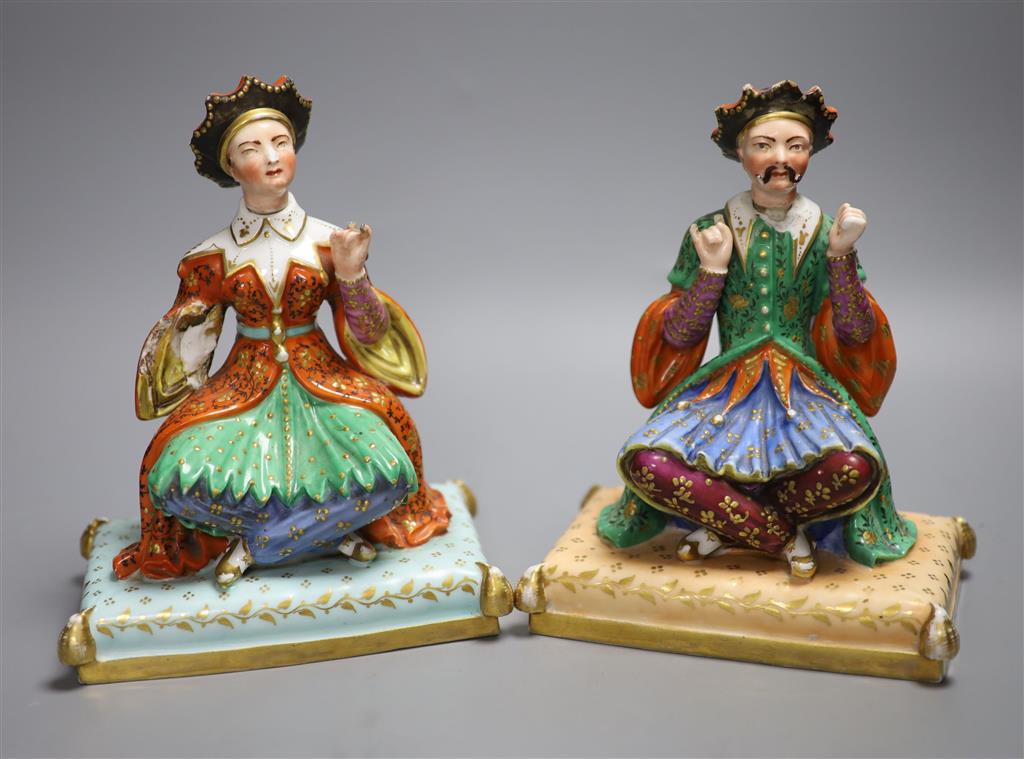 A pair of Jacob Petit mid 19th century scent bottles modelled as Ottoman Turkish seated figures, height 21cm